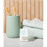 Close-up of DR. Wild TEBODONT-F Stretch Floss between teeth – fluffy cleaning thread