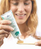 Close-up of DR. Wild TEBODONT-F toothpaste paste on toothbrush – plaque & gum support