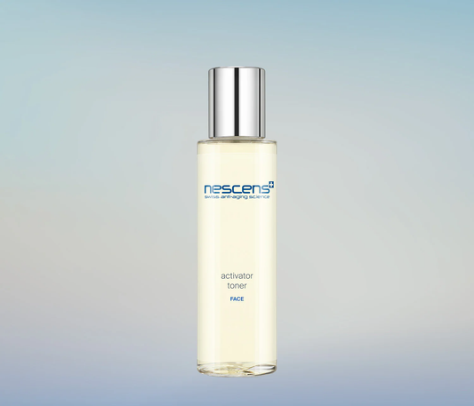 Nescens Activator Toner spray bottle with mist in motion