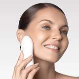 Woman using nebulyft R2 on neck for contouring at home