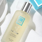 Applying RIVOLI Tonique Relaxant to face and neck – daily routine after cleansing