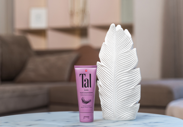 Applying TAL Care Hand & Nail Cream to dry hands and nails texture