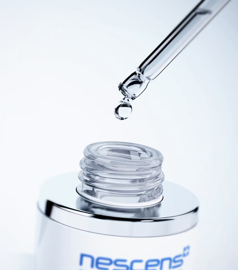 Close-up texture detail of rehydrating serum on fingertip