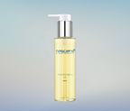 Nescens Total Anti-Aging Oil bottle with golden oil drop on glass