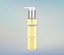 Nescens Total Anti-Aging Oil bottle with golden oil drop on glass